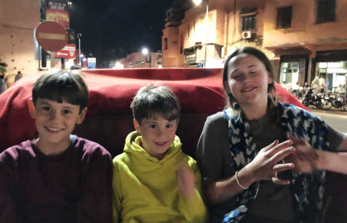 Family enjoying the lively city streets at night