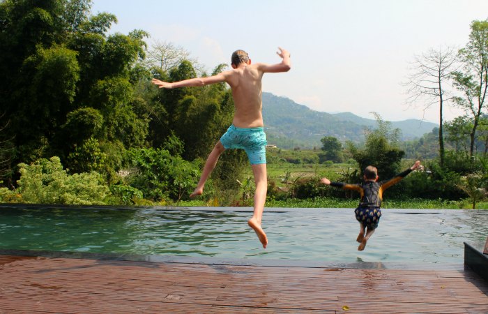 Nepal family holidays - kids jumping in a pool