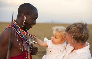 Travelling with toddlers - toddler meets a Masai warrior on a Kenya family safari