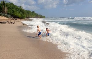 Children playing on a stunning sandy beach - Costa Rica family holidays