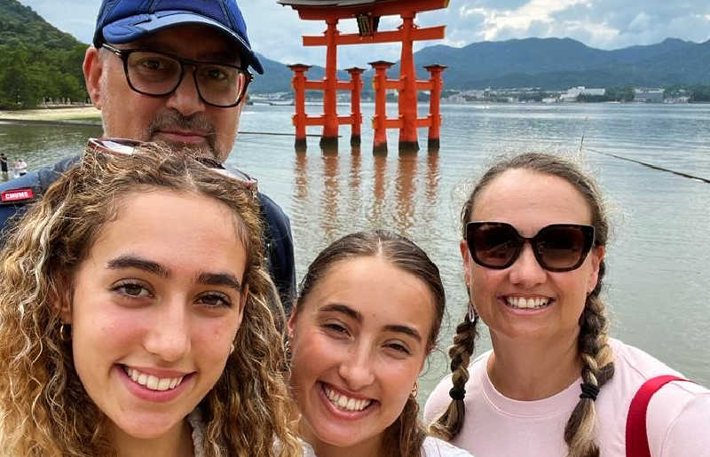 Family on Japan holiday with the Great Torii shrine in background