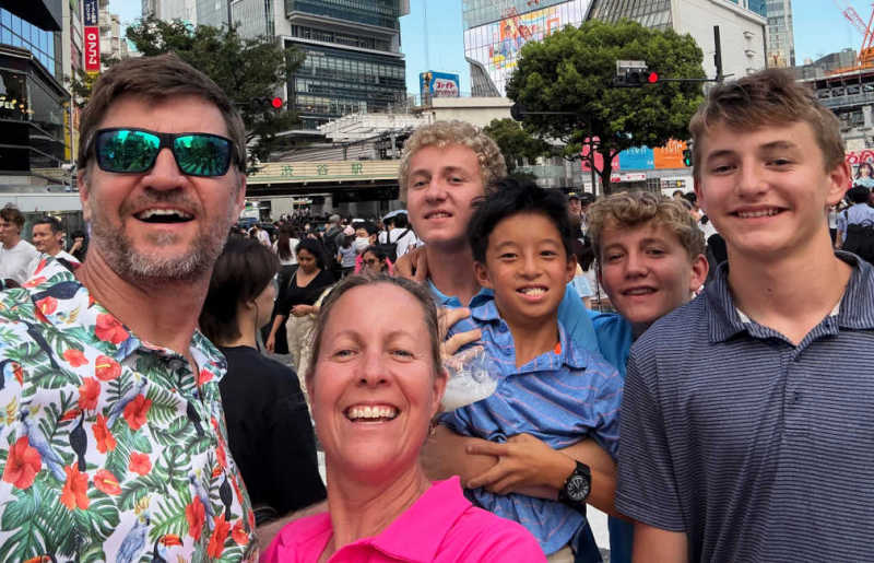 Family on holiday in Japan, at the Shibuya Crossing in Tokyo