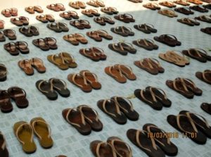 National Geographic kids award - Burma Myanmar - shoes carefully lined up at a convent