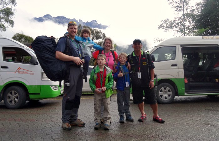 Family in the car park, ready to set off on our trip - climbing Mount Kinabalu with kids