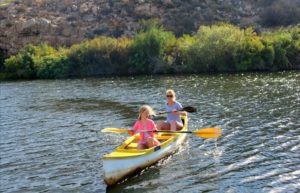 Liddy and daughter canoeing near Elgin, South Africa for families holiday
