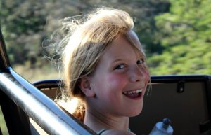 Excited young girl on safari