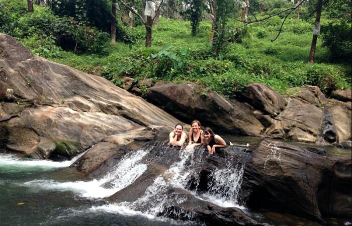 Swimming in a Mavady Hills rock pool on an India family holiday