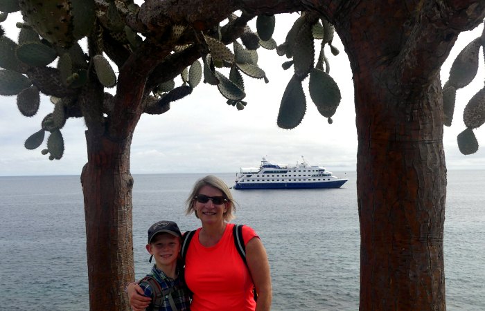 Santa Cruise II with trees and Helene on Galapagos Island Cruise