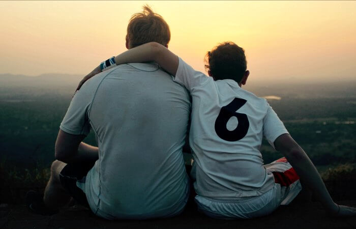 Father and son watching the sunset together in Sri Lanka - holidays with teenagers itinerary