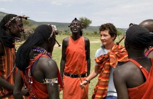 Family safari holiday in Kenya - teenager with young Masaai men