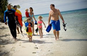 Family on beach in Belize - Family holiday tribe blog