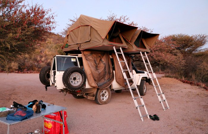 budget family holidays - pop up tent on a self drive trip in Namibia