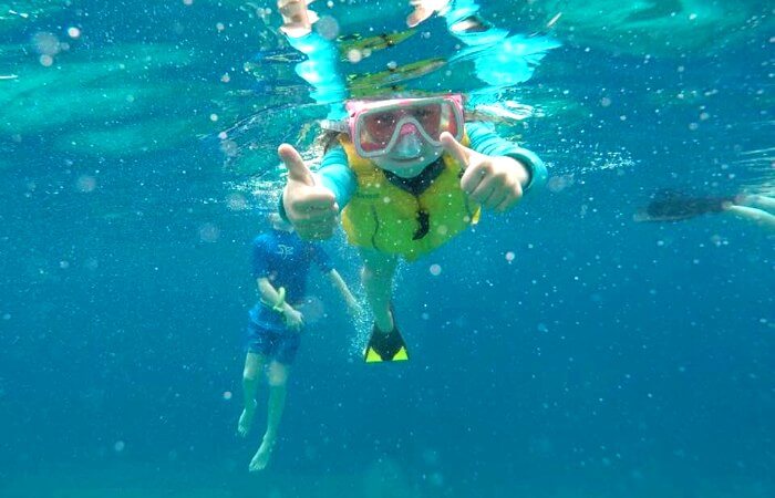 Kids on holiday snorkelling in Bali