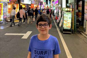 Japan with kids - street scene with young Stubborn Mule traveller