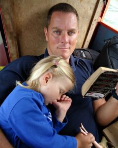 Child asleep on dad - kids holidays abroad blog