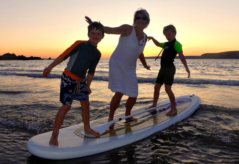 Stubborn Mule Consultant, Helene Cooper with her kids surfing