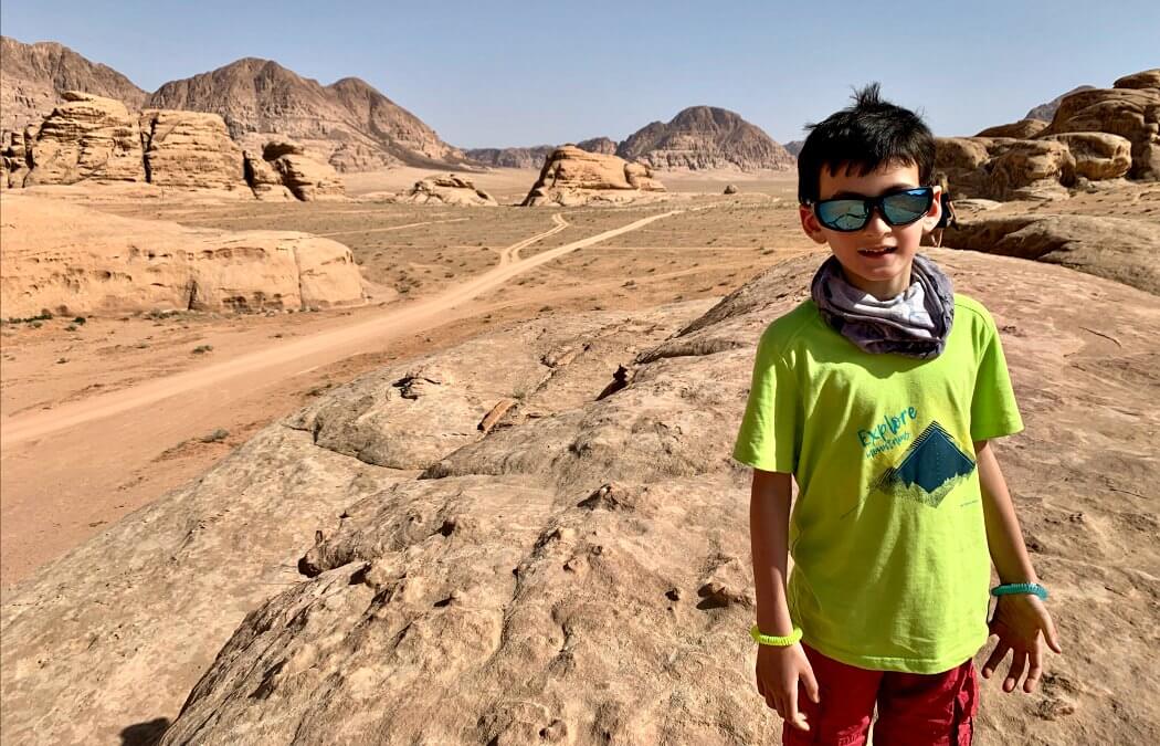 Boy exploring Wadi Rum in Jordan on an active family adventure holiday with Stubborn Mule Travel