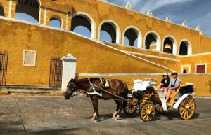 Horse and carriage at Izamal - Mexico with kids itinerary