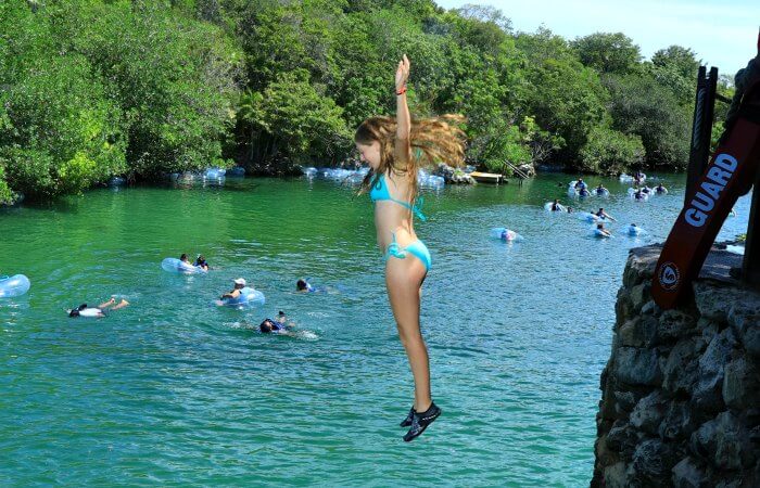 Jumping into the water at Punta Laguna, Mexico with children itinerary