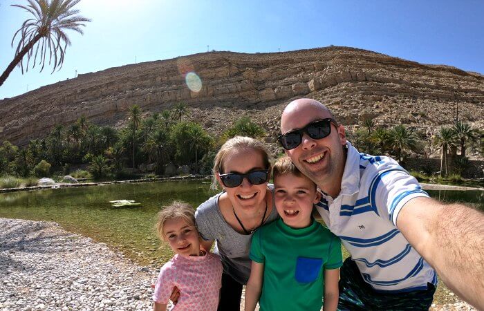 Family taking selfie at an Omani oasis