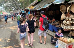 Family exploring a local market in Laos
