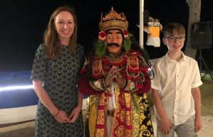 Mother and son with Balinese actor with mask