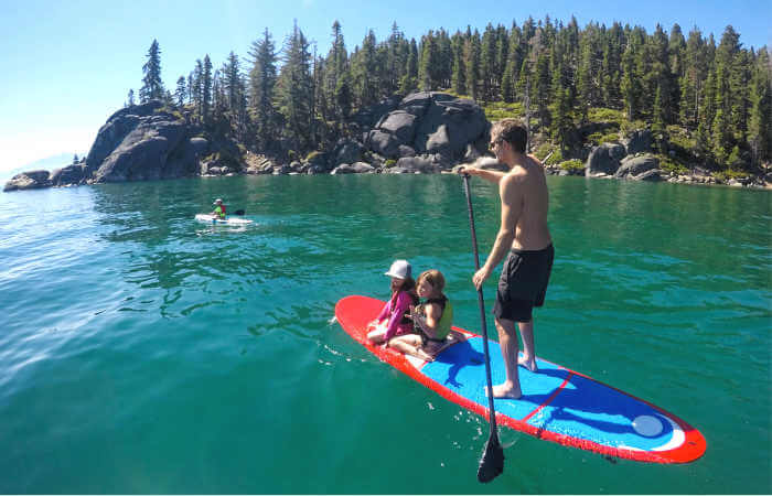 Family paddle boarding on Lake Tahoe - family road trips in USA