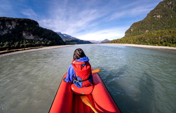 Girl kayaking, Glenorchy, on New Zealand family holiday