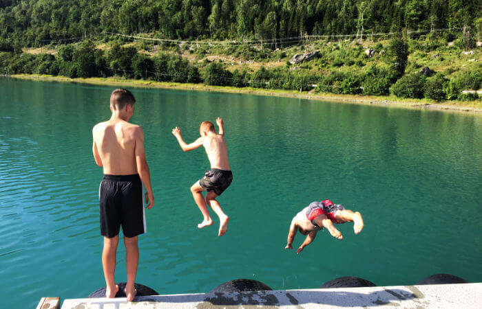 Swimming in crystal clear lakes on family holidays in Norway