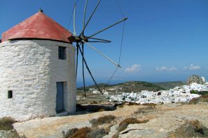 Amorgos island - traditional windmill and village with white-washed walls