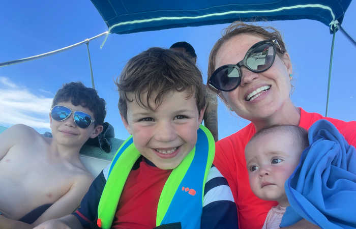 Family on holiday in Mexico - mum with three children - blue sky