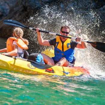 Father and daughter kayaking in Portugal