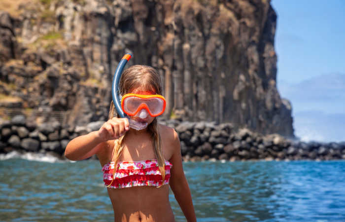 Girl snorkelling on a Madeira family holiday