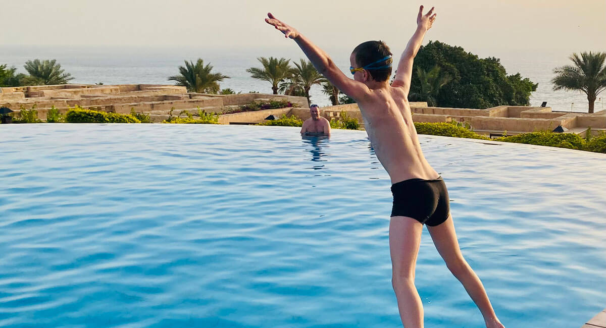 Family fun in a hotel swimming pool,Jordan