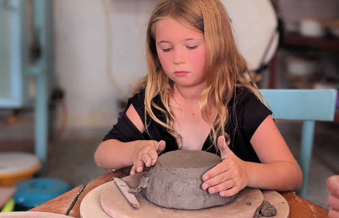 Learning how to make pots on a Greece with kids family holiday