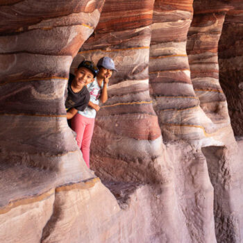 Pictures of Jordan, kids exploring caves at Petra