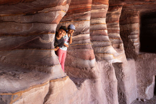 Pictures of Jordan, kids exploring caves at Petra