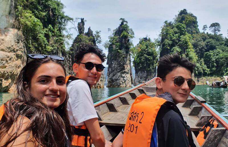 Teenagers exploring Thailand by boat