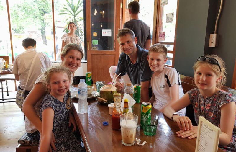Family with drinks in Thailand cafe - Stubborn Mule travellers