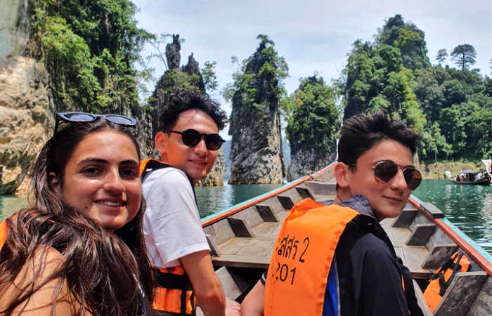 Teenagers exploring Thailand by boat