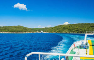 Car ferry travelling between islands in Croatia - blue sky and sea