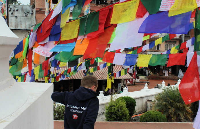 Rows of colourful prayer flags strung across the street - kids exploring Kathmandu - best cities for kids