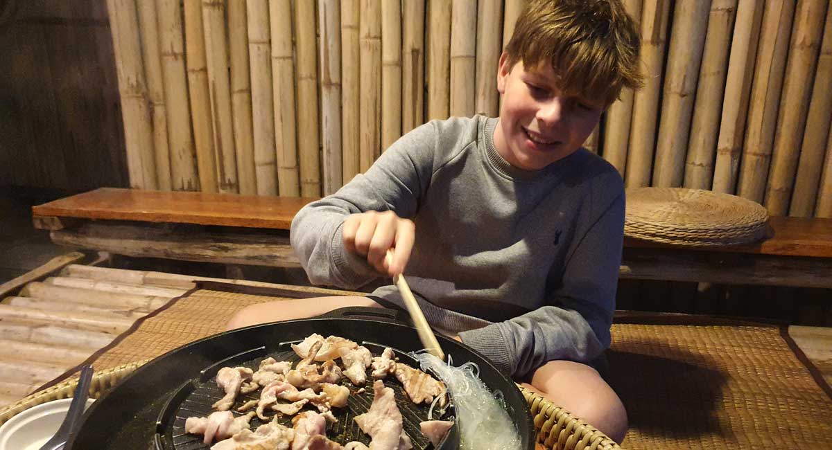 Cooking on bbq at homestay in Thailand - holiday photos of Thailand