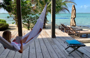 Enjoying reading in a hammock on a Belize trip