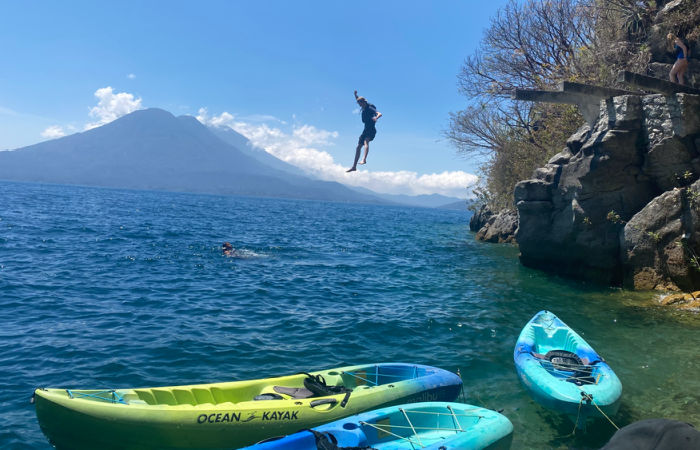 Jumping into Lake Atitlan and then kayaking on Guatemala family holidays