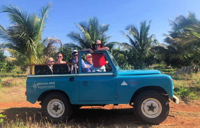 Family exploring a hacienda in Mexico by jeep