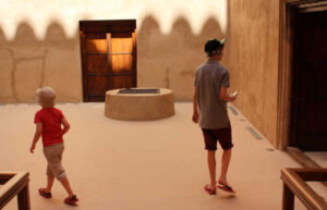 Family exploring Jebrin Fort, Oman