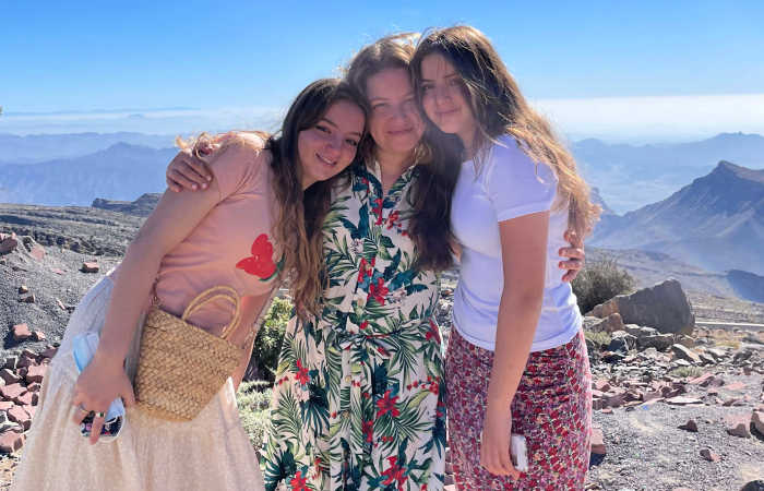 Family with teenagers exploring the mountains in Oman