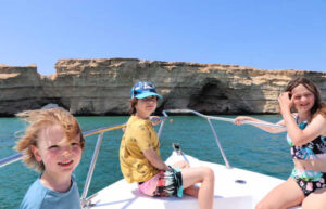 Kids on boat trip in Oman