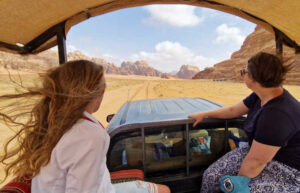 Family exploring Wadi Rum desert in Jordan - include this in February half-term holiday itineraries